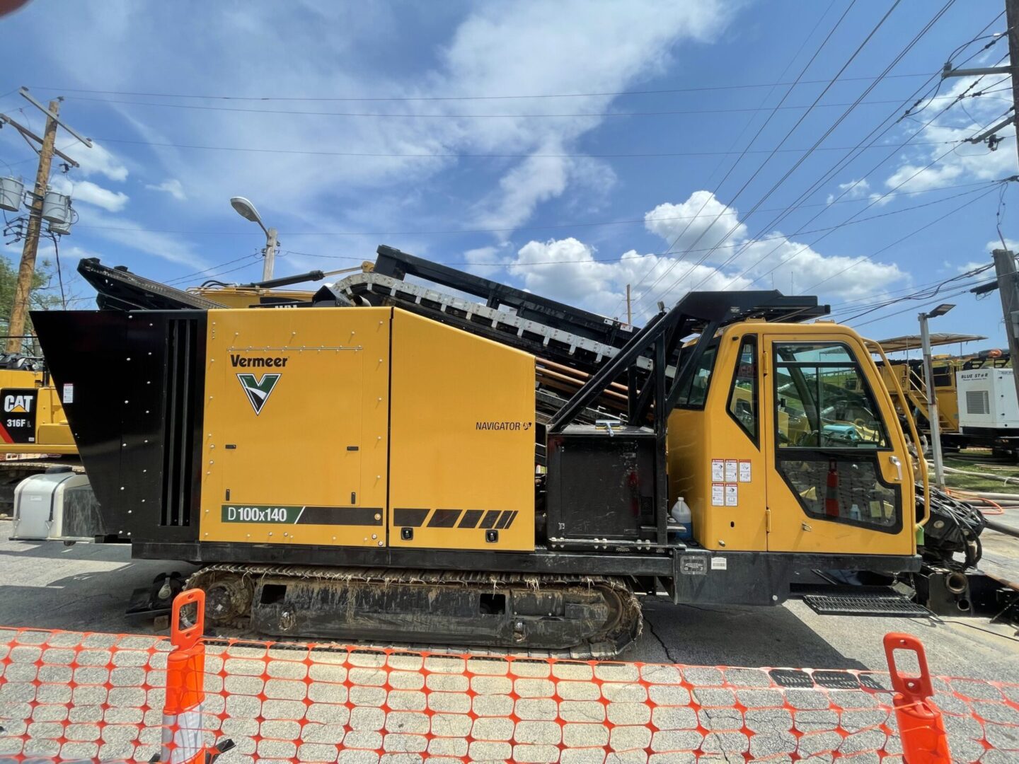 A yellow and black truck is parked on the side of road